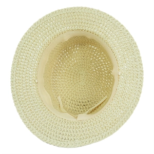 Detail view of woven straw hat interior featuring adjustable drawstring and sweatband