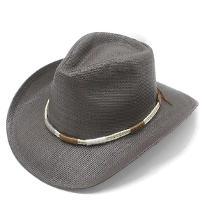 Macro shot of dark straw cowboy hat with braided decorative band and textured weave