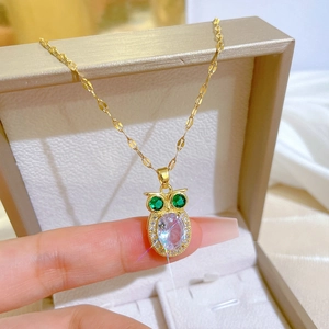 Golden owl pendant necklace with green gemstone eyes and clear crystal body for women