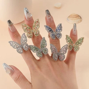 Stack of sparkling butterfly rings with colorful cubic zirconia and gold or silver finish