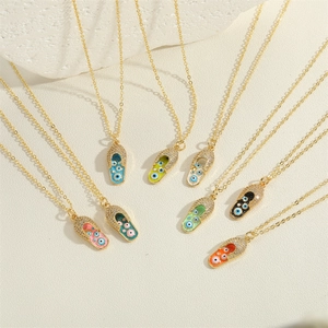Golden necklaces with colorful enamel flip-flop pendants featuring the evil eye and zircons