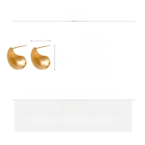 Detail view of gold teardrop earrings showing product dimensions 1.7x1cm and weight 6.7g