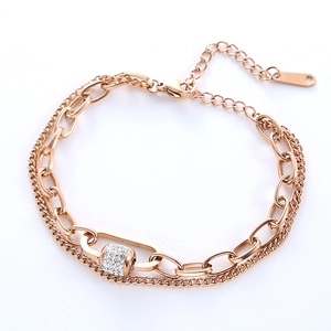 Rose gold layered chain bracelet featuring a sparkling pavé crystal cylinder bead