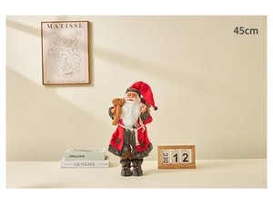 Detail of 45cm Santa Claus figurine holding a teddy bear in warm festive home decor setting