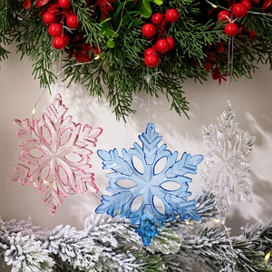 Transparent acrylic hexagonal snowflake ornaments in pink and blue for Christmas tree decor