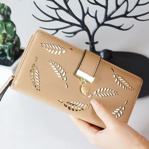 Women's long minimalist wallet in warm brown faux leather with hollow leaf pattern