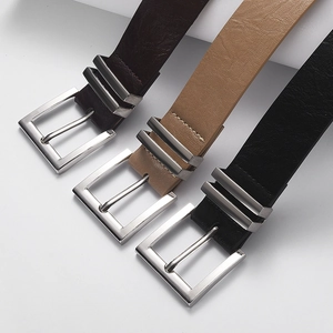 Three men's leather belts in dark brown, light brown and black with silver pin buckles