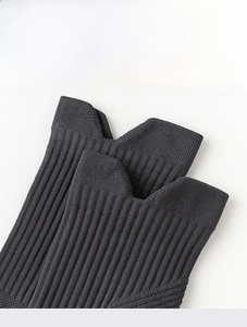 Detail of high-elasticity ribbed cuff on dark grey athletic crew socks for secure fit