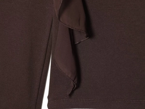 Detail of dark brown knit fabric showing 3D ruffle design and high-density texture