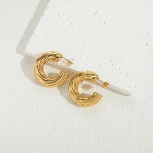 Detailed close-up of 14K gold plated C-shape earrings with a twisted spiral texture
