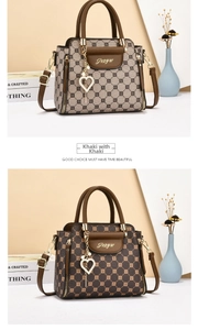 Detail view of khaki and brown monogram leather handbags with elegant heart pendants