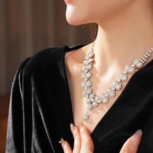Exquisite silver sun flower necklace with sparkling diamonds worn by a model