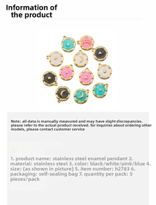 Detailed view of stainless steel celestial pendants in black, white, pink and blue
