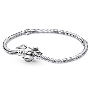 Silver snake chain bracelet with golden snitch winged clasp on white background