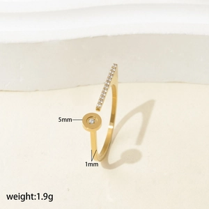 Detailed view of adjustable gold titanium ring with zircon settings and 1.9g weight specs