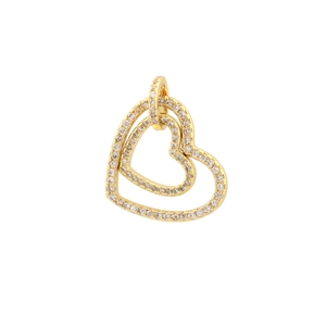 Macro detail of a double heart gold pendant with micro-pave white zirconia crystals