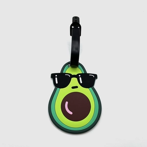 Detail of green avocado luggage tag made of soft PVC with a secure black leather strap