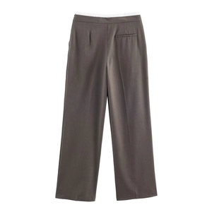 Detail of high-waist wide-leg trousers in dark brown with a functional back pocket