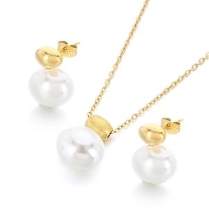 Minimalist gold necklace and earrings set with elegant white oval baroque pearls