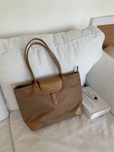 Large capacity nylon tote bag for women, stylish commute shoulder bag with elegant design.