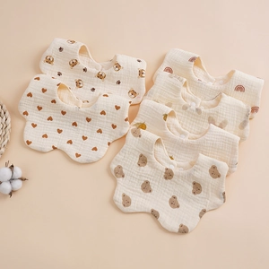 Detail of soft 6-layer cotton gauze baby bibs with cute animal and heart patterns