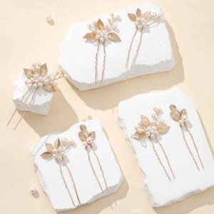Golden leaf hair pins set with white pearls for elegant wedding bridal hairstyles
