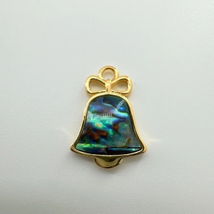 Detail view of 18K gold-plated bell pendant with iridescent abalone shell inlay