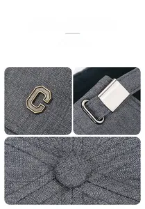 Detail of grey baseball cap featuring metal letter C logo and adjustable metal buckle strap