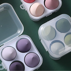 Set of 4 makeup sponges in clear storage box, available in pink, purple, and green colors