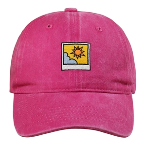 Detail of rose red washed cotton baseball cap with embroidered sun and cloud patch