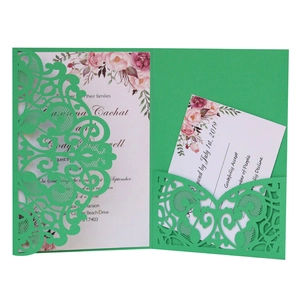 Detailed view of green laser cut lace wedding invitation pocket with floral RSVP card