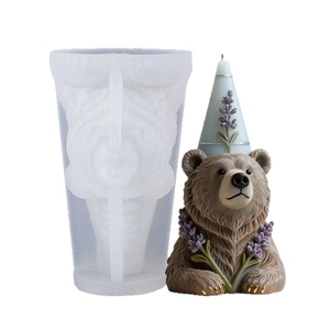 DIY bear candle silicone mold with a finished bear holding lavender and party hat
