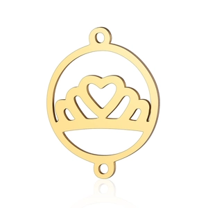 Close-up of golden stainless steel crown and heart charm connector for jewelry making