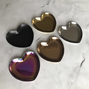 Macro shot showing five colorful heart-shaped stainless steel jewelry storage trays