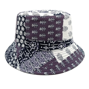 Detail of bohemian patchwork bucket hat showing purple paisley prints and reinforced stitching