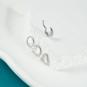 Silver stainless steel nose ring set with heart and round shapes on white stone