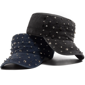 Distressed cotton cadet caps with punk metal rivets in black and navy blue tones