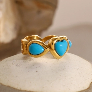 Golden stainless steel ring with turquoise heart and teardrop design elements