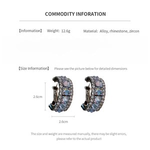 Tableau détaillé montrant la taille 2.6cm et matériaux des boucles d'oreilles zircon