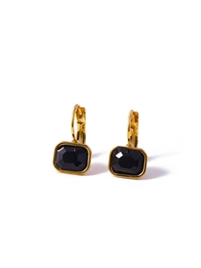 Close-up of golden hoop earrings featuring rectangular black zircon stones on white background