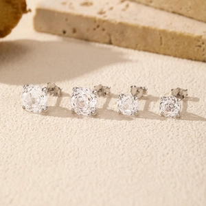 Set of four S925 sterling silver stud earrings with rose cut clear diamonds on stone