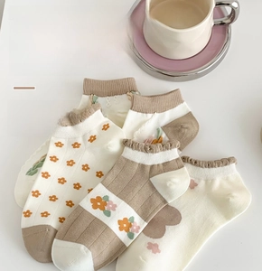 Detail of four pairs of soft Xinjiang cotton low-cut socks with floral and heart patterns