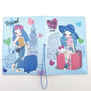Detailed flat lay of blue travel passport cover with cartoon girls and elastic strap