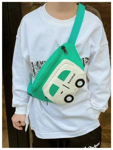 Detail view of cartoon car-shaped kid chest bag in bright green and white canvas