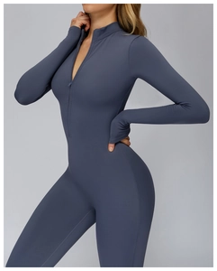 Detail of high-neck half-zip jumpsuit with long sleeves and thumbholes in slate blue