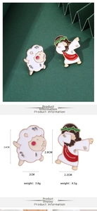 Detail view of Jesus and lamb enamel pins with dimensions and weight measurements