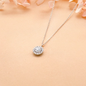 Detailed view of S925 sterling silver necklace with halo diamond set round gemstone pendant