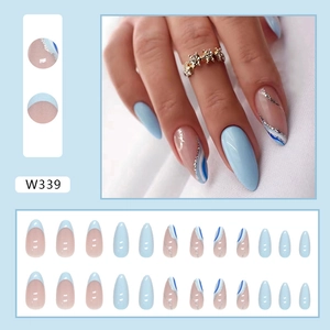 Almond-shaped press-on nails with light blue french tips and silver glitter wave art