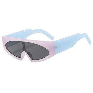 Futuristic wide-frame oversized sunglasses in purple and blue with gold rivet accents
