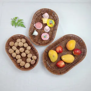 Three sizes of brown woven rattan baskets for serving bread, snacks, and fresh fruits
